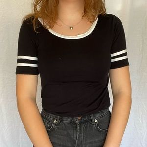 Black fitted tee w/ white stripes on sleeves and collar